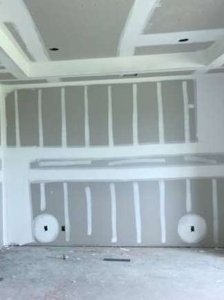 taping and finishing drywall to prepare for painting