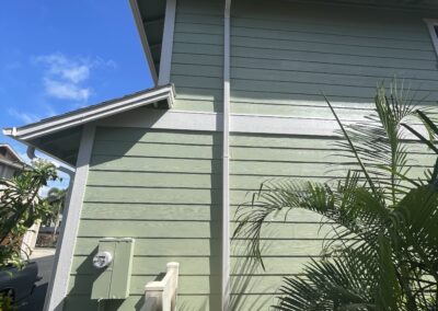 AFTER - exterior painting of green house in Hawaii by Mckeague Drywall
