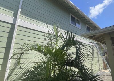 AFTER - exterior painting of green house in Hawaii by Mckeague Drywall
