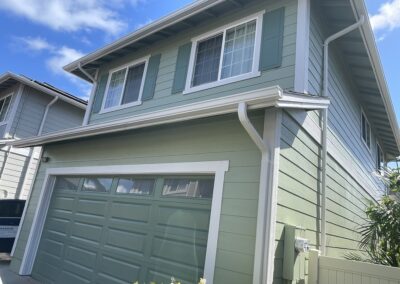 AFTER - exterior painting of green house in Hawaii by Mckeague Drywall