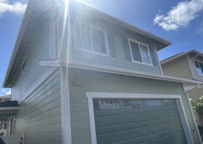 AFTER - exterior painting of green house in Hawaii by Mckeague Drywall