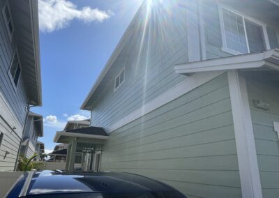 AFTER - exterior painting of green house in Hawaii by Mckeague Drywall