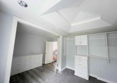 photo showing a second floor room with a newly finished octagon shaped ceiling with recessed lighting and painted walls and cupboards and dressers that were completed by Mckeague Drywall in mililani oahu hawaii