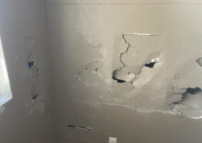 photo showing how Mckeague Drywall LLC repairs damaged drywall beginning with using a colored pencil to mark off the area to be replaced