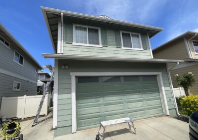 BEFORE - exterior painting of green house in Hawaii by Mckeague Drywall with dull paint