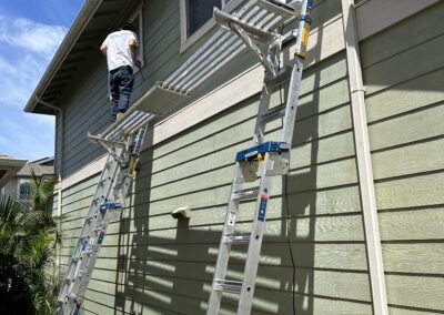 BEFORE - exterior painting of green house in Hawaii by Mckeague Drywall