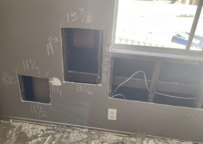 photo showing how Mckeague Drywall LLC repairs damaged drywall with chalk markings showing the precise measurements of each piece of new drywall that needs to be cut and replaced