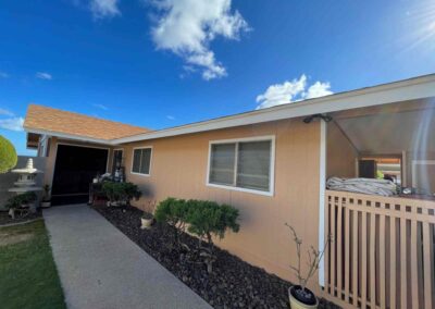 A home in Hawaii that had its exterior painted tan by Mckeague Drywall