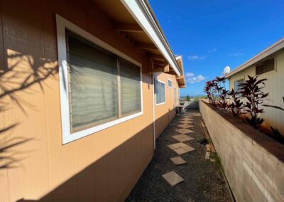 A home in Hawaii that had its exterior painted tan by Mckeague Drywall