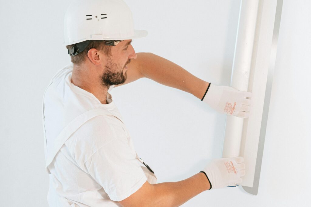 Man working on drywall